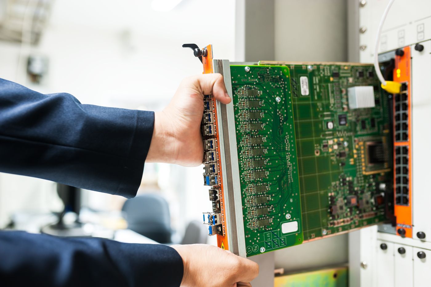 Technician working on network switch hardware